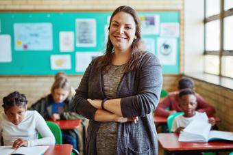 Confident young woman teaching children, symbolizing passion in work