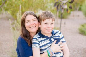 A mother and son share a tender moment, highlighting the deep emotional connection and love in their relationship.