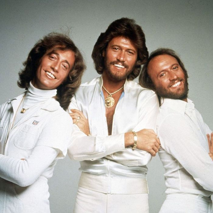 The Bee Gees, creators of the iconic love song 'How Deep Is Your Love', known for their harmonious sound and romantic ballads.