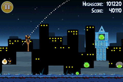 alt text: Screenshot of Angry Birds displaying birds attacking a pig structure made of ice.