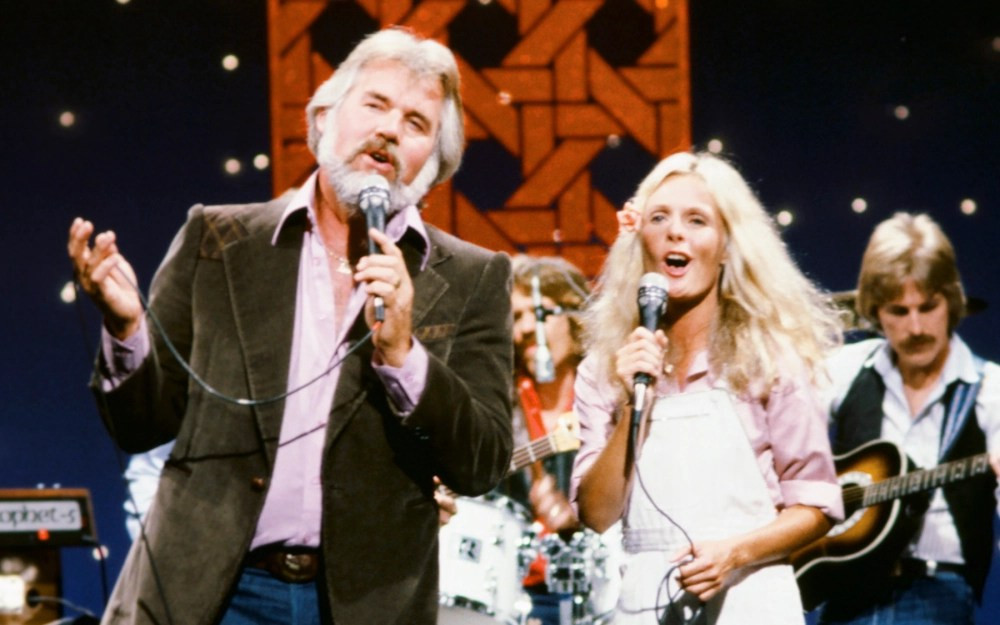 Kenny Rogers and Kim Carnes in a promotional banner.