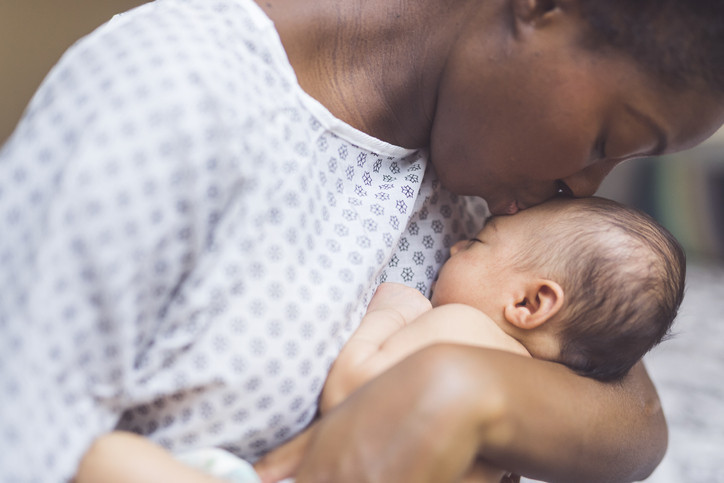 A mother breastfeeding her baby, highlighting the role of oxytocin in bonding and milk production.